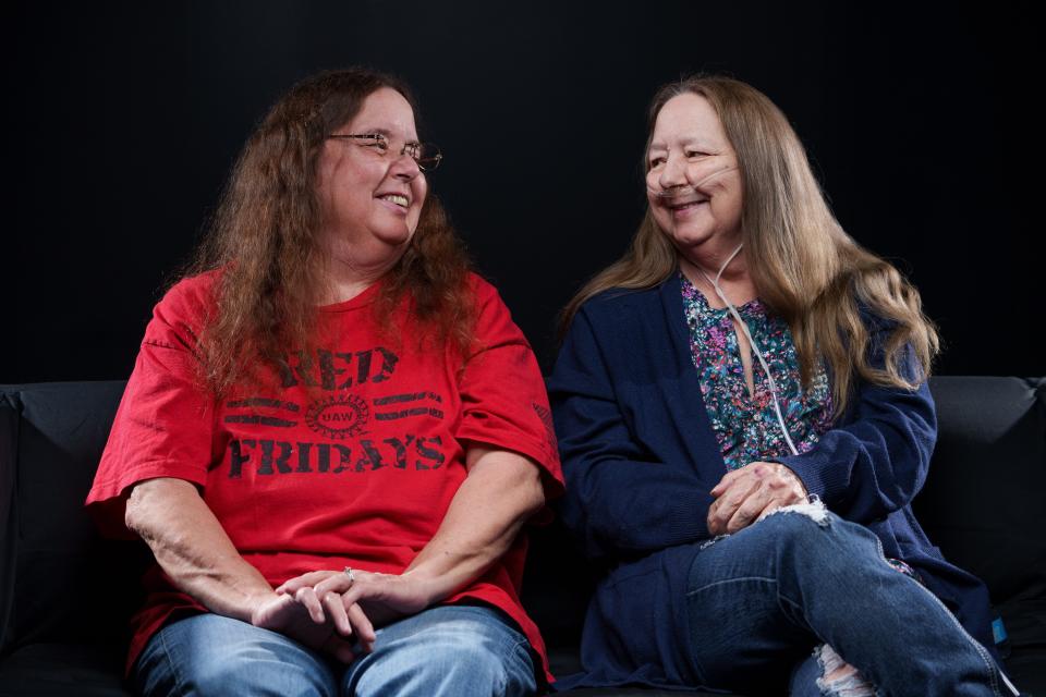 Sisters Sheri Rottler Trick, left, and Kathie Rottler smile at each other after talking about the solving of their 1975 assault case that had gone cold for nearly 50 years.