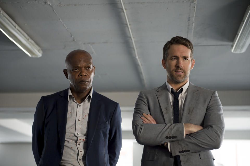 This image released by Lionsgate shows Samuel L. Jackson, left, and Ryan Reynolds in “The Hitman’s Bodyguard.” (Jack English/Lionsgate via AP)