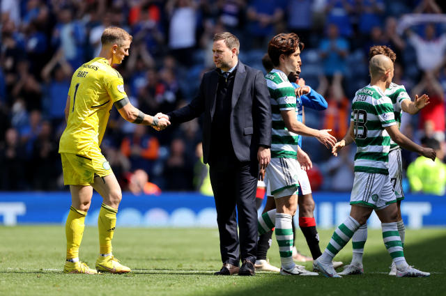 Michael Beale, second left, shakes hands with Celtic goalkeeper Joe Hart after the match