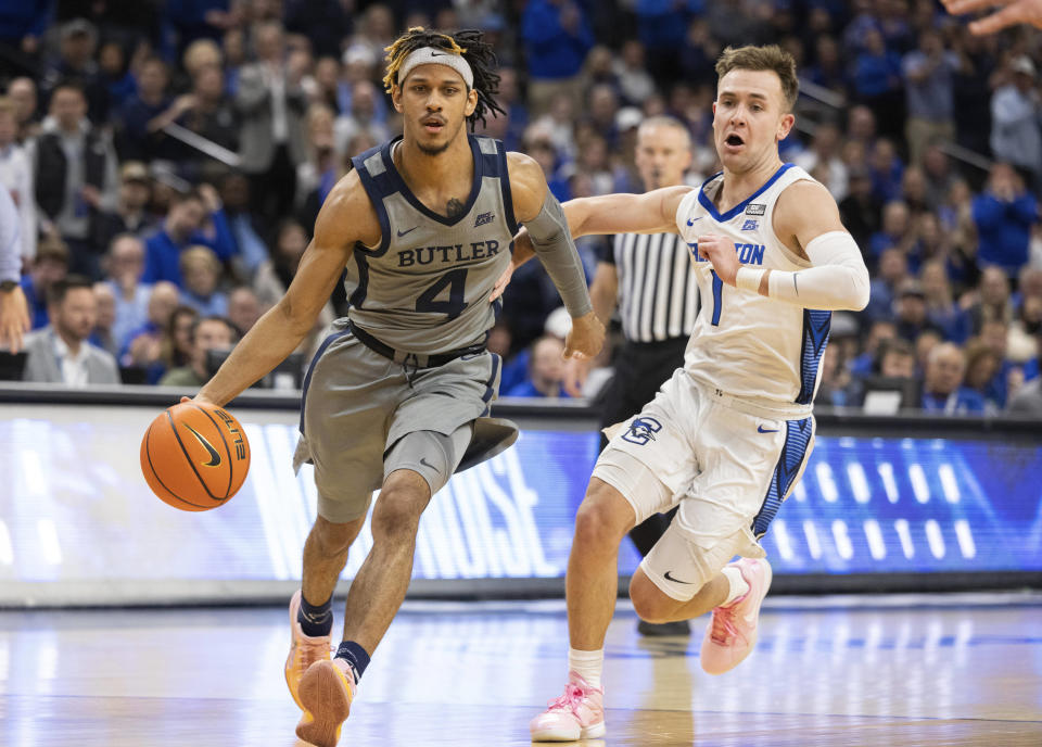 Butler's DJ Davis (4) drives against Creighton's Steven Ashworth (1) during the first half of an NCAA college basketball game Friday, Feb. 2, 2024, in Omaha, Neb. (AP Photo/Rebecca S. Gratz)