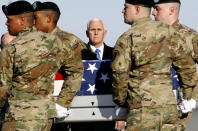 Vice President Mike Pence stands at attention as a U.S. Army carry team moves a transfer case containing the remains of Spc. Joseph P. Collette, Sunday, March 24, 2019, at Dover Air Force Base, Del. According to the Department of Defense, Collette, of Lancaster, Ohio, was killed March 22 while involved in combat operations in Kunduz Province, Afghanistan. (AP Photo/Patrick Semansky)