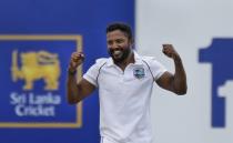 West Indies bowler Veerasammy Permaul celebrates taking the wicket of Sri Lanka's Lasith Embuldeniya during the day two their second test cricket match in Galle, Sri Lanka, Tuesday, Nov. 30, 2021. (AP Photo/Eranga Jayawardena)