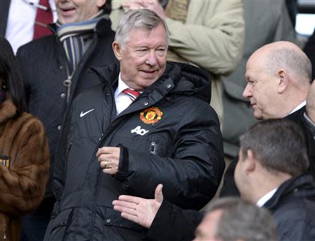 Former Manchester United manager Alex Ferguson takes his seat before their English Premier League soccer match against Hull City at the KC Stadium in Hull, northern England December 26, 2013. REUTERS/Nigel Roddis