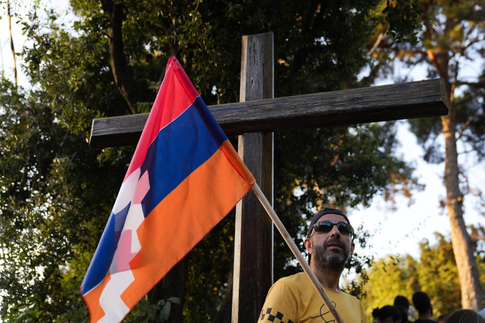 FILE - Lebanese Armenian holds a flag of Nagorno-Karabakh during a protest outside the Azerbaijani embassy in Beirut, Lebanon, on Thursday, Sept. 28, 2023. The swift fall of the Armenian-majority enclave of Nagorno-Karabakh to Azerbaijani troops and exodus of much of its population has stunned the large Armenian diaspora around the world. Hundreds of Lebanese Armenians on Thursday protested outside the Azerbajani Embassy in Beirut. (AP Photo/Hussein Malla, File)