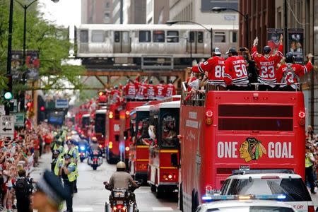 Jun 18, 2015; Chicago, IL, USA; The Chicago Blackhawks parade makes its way east on Monroe during the 2015 Stanley Cup championship parade and rally at Soldier Field. Mandatory Credit: Jon Durr-USA TODAY Sports