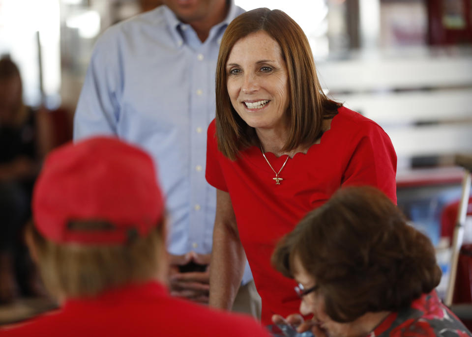 Arizona Republican senatorial candidate Martha McSally, speaks with voters, Tuesday, Nov. 6, 2018, at Chase's diner in Chandler, Ariz. McSally and Democratic challenger Kirsten Sinema are seeking the senate seat being vacated by Jeff Flake, R-Ariz., who is retiring in January. (AP Photo/Matt York)