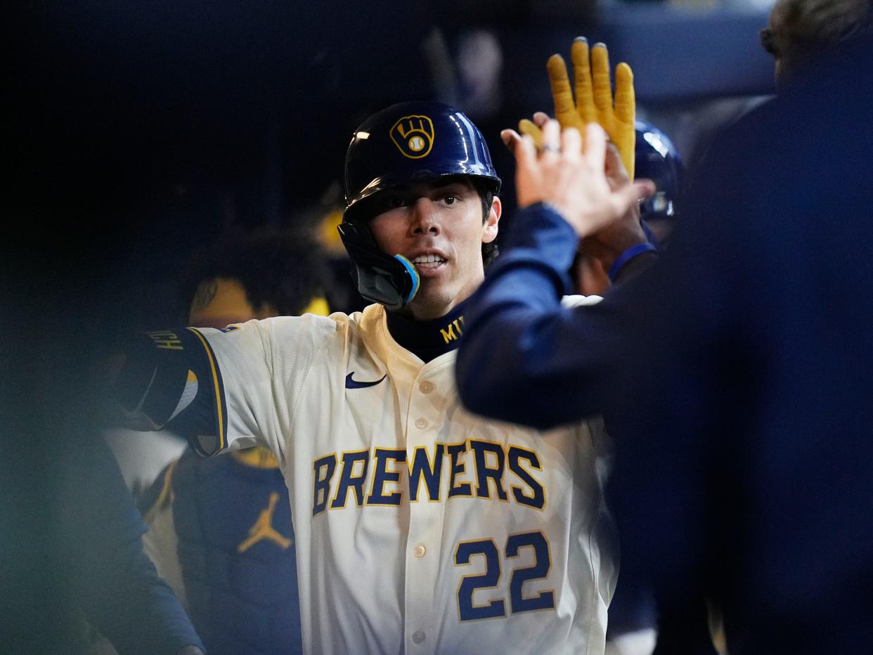 Milwaukee Brewers left fielder Christian Yelich (22) homers (2) on a fly ball to center field during the third inning of the game against the Minnesota Twins on Tuesday April 2, 2024 at American Family Field in Milwaukee, Wis.