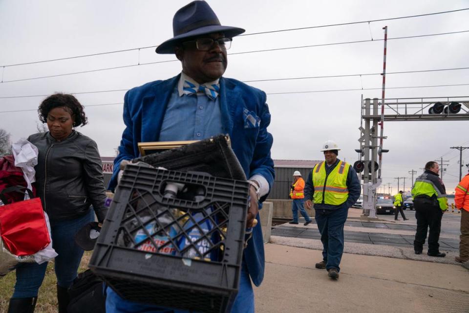 Rev. Solomon Butler retrieves his things from his car, which crashed into a MetroLink train after a brake failure on Jan. 3, 2024.