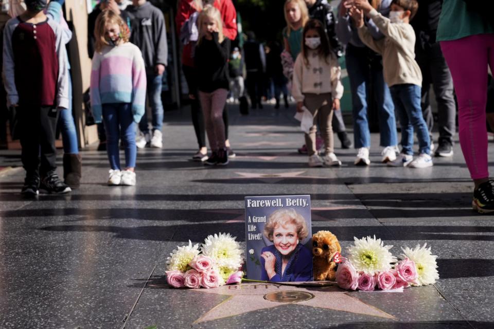 A memorial to Betty White appears at her star on the Hollywood Walk of Fame after news of her death at age 99.