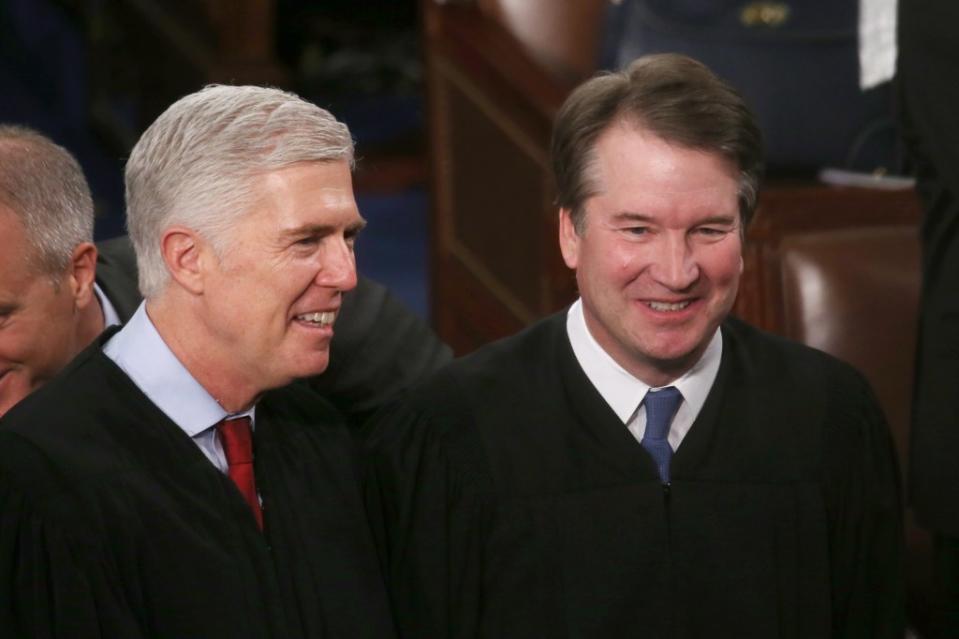 Supreme Cout Justices Neil Gorsuch (left) and Brett Kavanaugh are among those linked to an “extreme religious ideology” that Donald Trump caters to, Bishop Joseph Tolton contends. (Photo by Mario Tama/Getty Images)