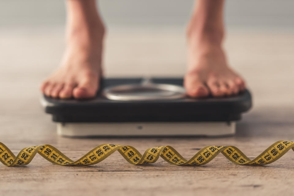 New research has revealed we gain more weight when we eat while we’re stressed [Photo: Getty]