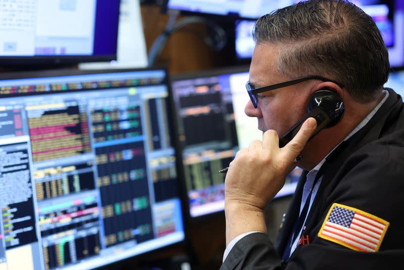 A trader works on the trading floor at the New York Stock Exchange (NYSE) in New York City