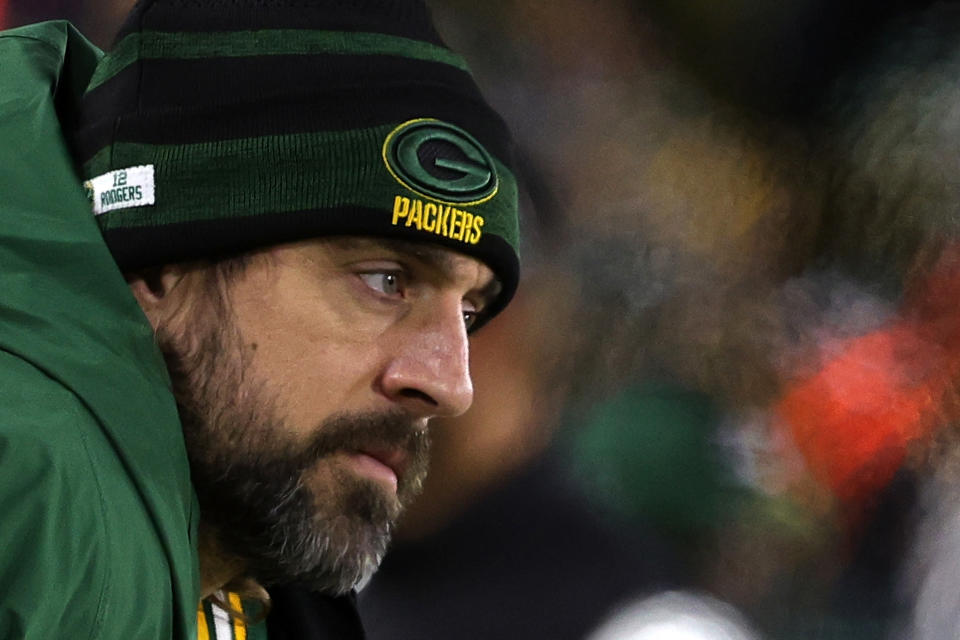 GREEN BAY, WISCONSIN - DECEMBER 25: Aaron Rodgers #12 of the Green Bay Packers watches action from the sideline during a game against the Cleveland Browns at Lambeau Field on December 25, 2021 in Green Bay, Wisconsin.  The Packers defeated the Browns 24-22. (Photo by Stacy Revere/Getty Images)