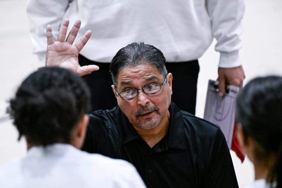 Mt. Whitney's Head Coach Louie Perez directs his team against Porterville in an East Yosemite League high school girls basketball game Tuesday, January 9, 2024.