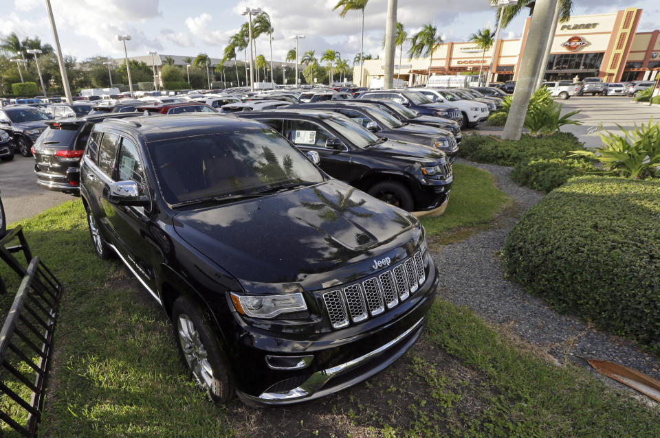 <p> FILE - In this Thursday, Nov. 5, 2015, file photo, 2015 Jeep Grand Cherokees appear on display at a Fiat Chrysler dealership in Doral, Fla. On Thursday, Jan. 12, 2017, the U.S. government alleged that Fiat Chrysler Automobiles failed to disclose that software in some of its pickups and SUVs with diesel engines allows them to emit more pollution than allowed under the Clean Air Act. The Environmental Protection Agency said in a statement that it issued a "notice of violation" to the company that covers about 104,000 vehicles, including the 2014 through 2016 Jeep Grand Cherokee and Dodge Ram pickups, all with 3-liter diesel engines. (AP Photo/Alan Diaz, File) </p>