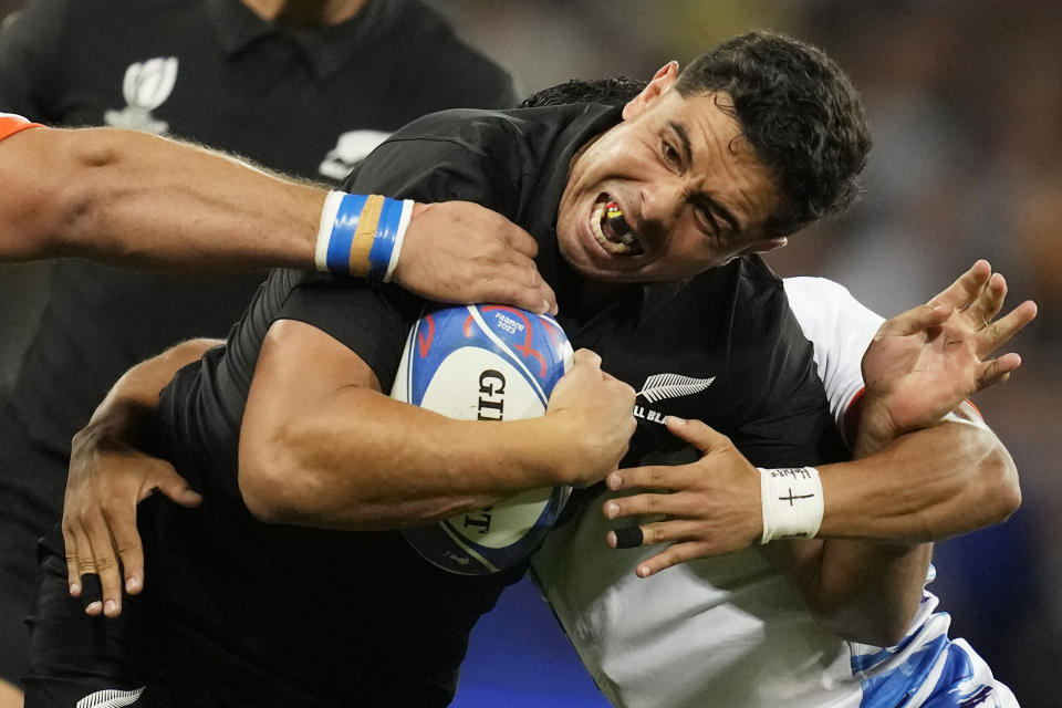 New Zealand's Anton Lienert-Brown, centre, challenges for the ball during the Rugby World Cup Pool A match between New Zealand and Namibia at the Stadium de Toulouse in Toulouse, France, Friday, Sept. 15, 2023. (AP Photo/Christophe Ena)