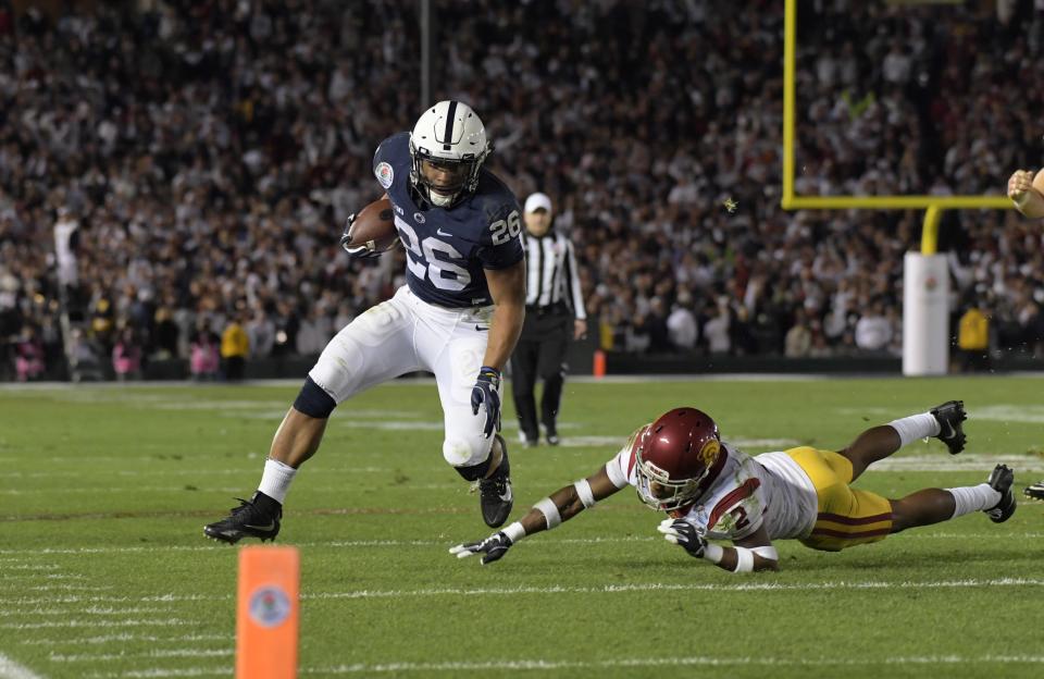 Jan 2, 2017; Pasadena, CA, USA; Penn State Nittany Lions running back Saquon Barkley (26) is defended by USC Trojans defensive back Adoree' Jackson (2) during the 103rd Rose Bowl at Rose Bowl. USC defeated Penn State 52-49 in the highest scoring game in Rose Bowl history. Mandatory Credit: Kirby Lee-USA TODAY Sports