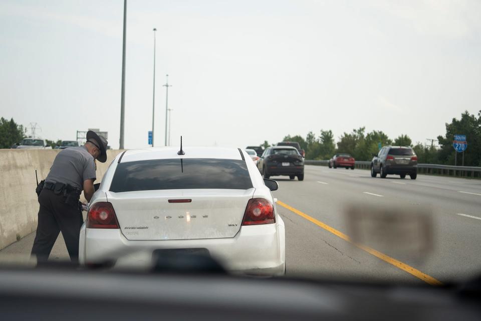 State Highway Patrol trooper Bill Duerson, talks to someone he caught speeding on I-270 near Columbus during their zero-tolerance speeding and reckless driving enforcement day.