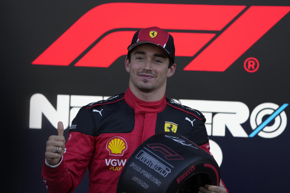 Charles Leclerc, of Monaco, celebrates with his trophy after winning pole position during the Formula One Mexico Grand Prix auto race at the Hermanos Rodriguez racetrack in Mexico City, Saturday, Oct. 28, 2023. (AP Photo/Fernando Llano)