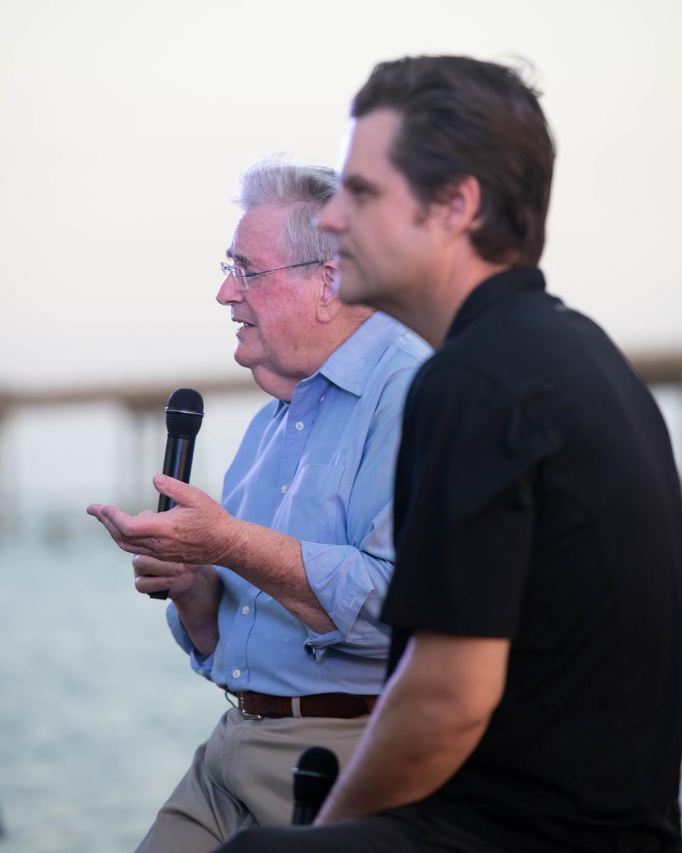 Congressman Matt Gaetz, right, and his father Don Gaetz speak during a campaign rally at Navarre Park in Navarre on Monday, Oct. 30, 2023.