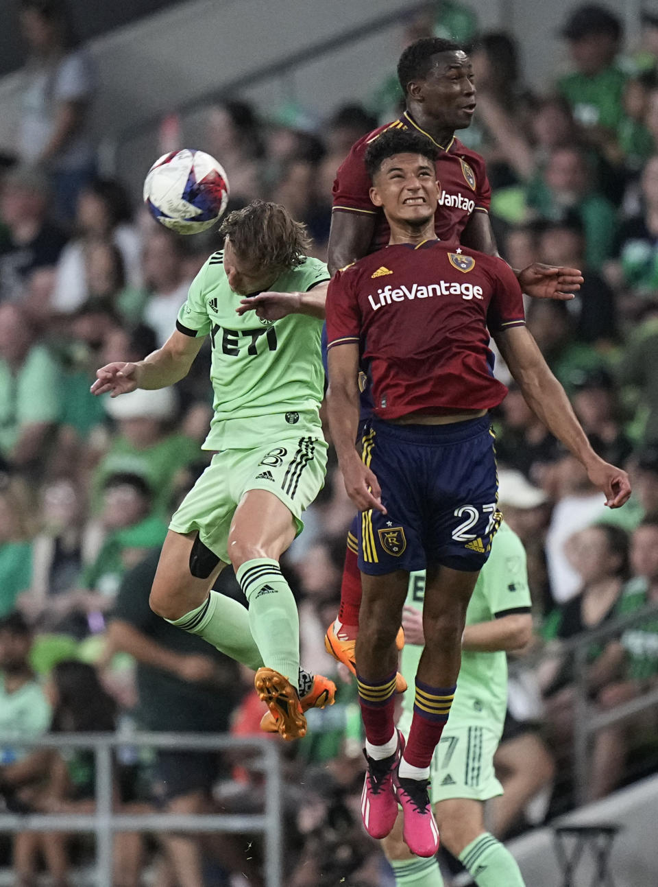Austin FC midfielder Alexander Ring (8) heads the ball away from Real Salt Lake forward Bertin Jacquesson (27) and midfielder Anderson Julio, rear, during the first half of an MLS soccer match in Austin, Texas, Saturday, June 3, 2023. (AP Photo/Eric Gay)