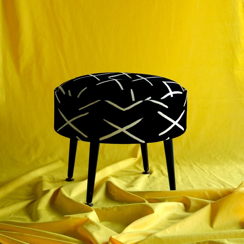 This chunky midcentury stool was reupholstered in a bold monochrome ‘X’ fabric.