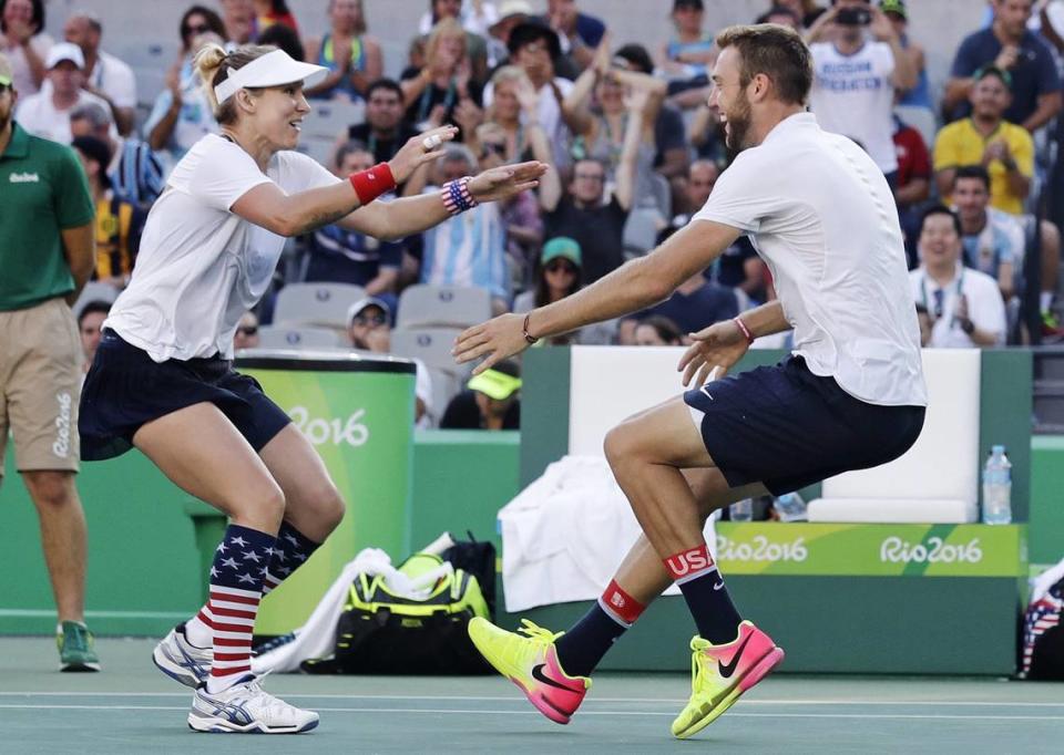 Bethanie Mattek-Sands, of the United States, left, runs into the arms of partner Jack Sock, after winning their mixed doubles gold medal match at the 2016 Summer Olympics in Rio de Janeiro, Brazil.
