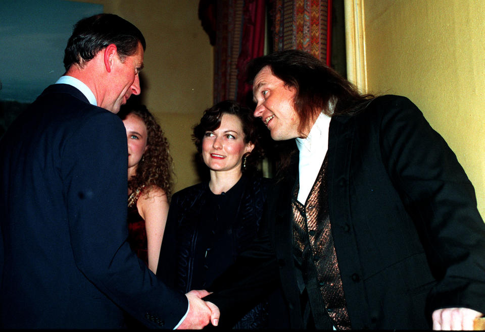 PA NEWS 17/11/94 THE PRINCE OF WALES SHAKES HANDS WITH SINGER Meat Loaf (RIGHT), ACCOMPANIED BY HIS WIFE LESLEY (CENTRE), BEFORE Meat Loaf'S CONCERT IN AID OF THE PRINCE'S TRUST AT THE ROYAL ALBERT HALL, LONDON.   (Photo by Sean Dempsey - PA Images/PA Images via Getty Images)