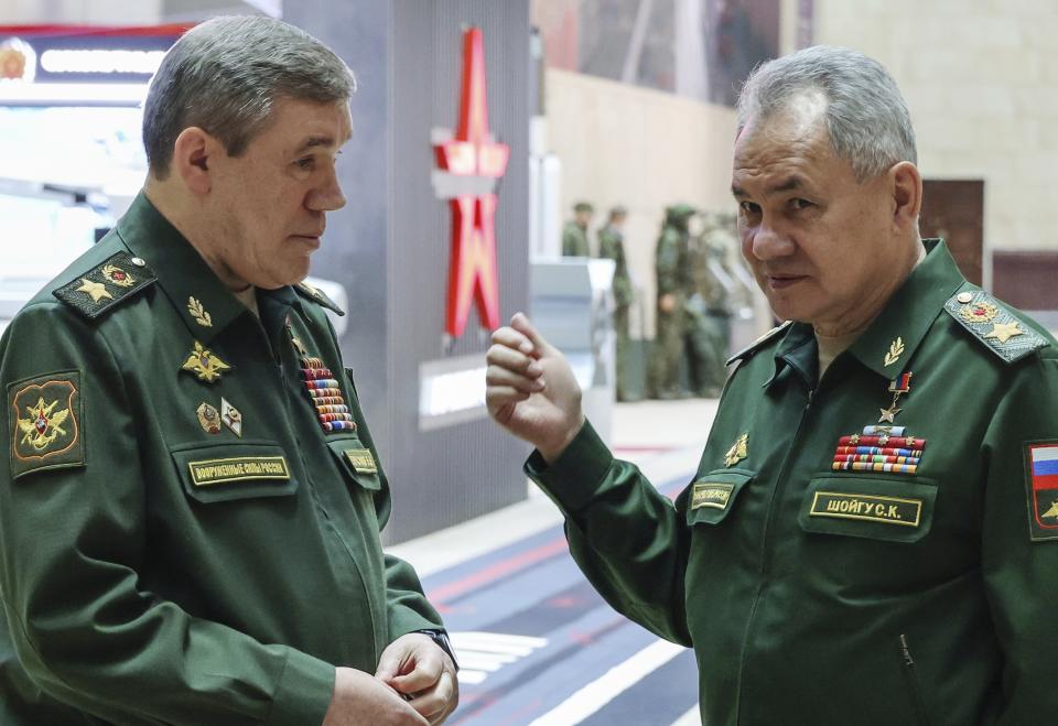 FILE - Russian Defense Minister Sergei Shoigu, right, gestures as he speaks to Russian Chief of General Staff Gen. Valery Gerasimov prior to a meeting Russian President Vladimir Putin with the top military brass in Moscow, Russia, Tuesday, Dec. 19, 2023. The Kremlin says Russia's President Vladimir Putin has signed a decree appointing Sergei Shoigu as secretary of Russia's national security council, replacing Nikolai Patrushev. The appointment Sunday comes after Putin proposed to appoint Andrei Belousov as the country's defense minister instead of Shoigu, who has served in the post for years. (Sputnik, Kremlin Pool Photo via AP, File)
