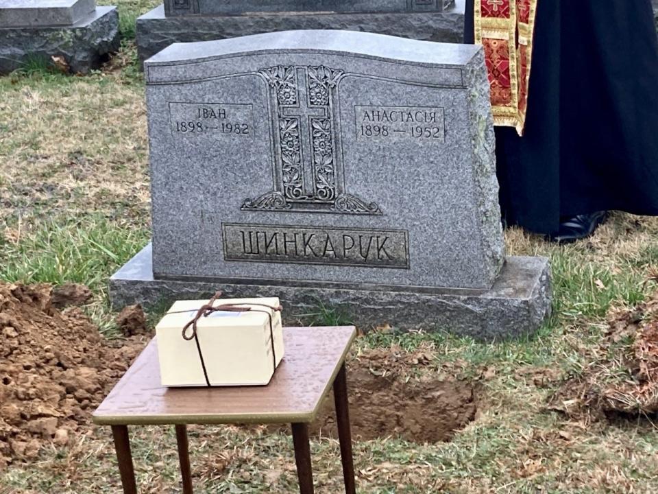 A box containing the cremated remains of Casimir Shynkaruk waits to be buried in the same plot as his parents, Anastasia and John Ivan on March 25, 2023.   Shynkaruk died in 1999 and he was the longest unclaimed decedent in the Bucks County Coroner's office possession.