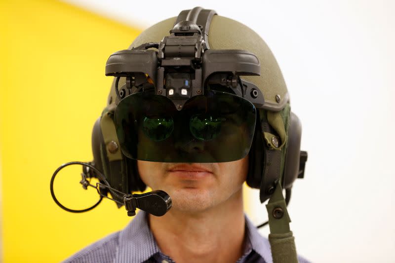 FILE PHOTO: An employee wears IronVision, a 360-degree helmet display system for tank troops, during a preview presentation at Elbit Systems