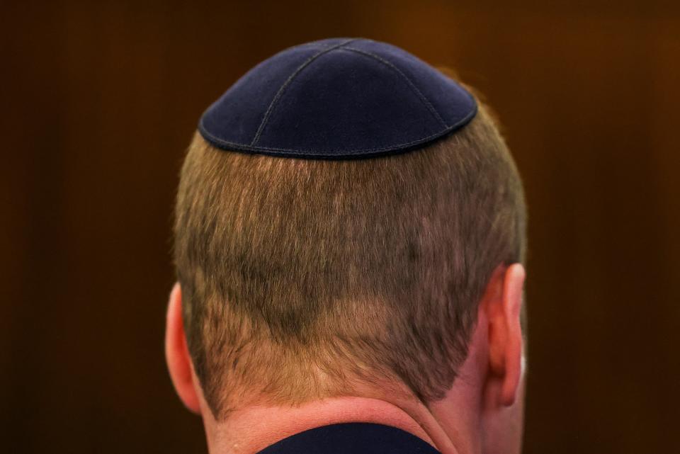 Prince William wears a kippah as he visits the Western Marble Arch Synagogue, in London, Britain (REUTERS)