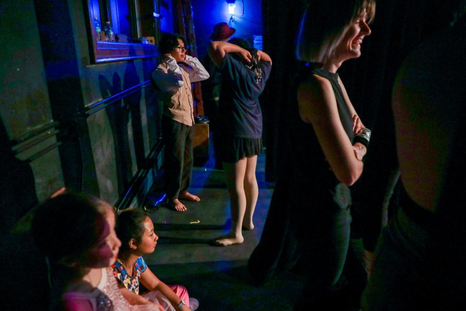 Students and instructors watch from backstage as other students perform on stage during the Artlab J dance recital at Marygrove College in Detroit on June 9, 2023.