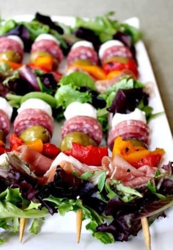 Mantitlement<p>These antipasto salad kabobs are a perfect party appetizer because there’s something for everyone!</p><p><strong>Get the recipe: <a href="https://www.mantitlement.com/antipasto-salad-kabobs/" rel="sponsored" target="_blank" data-ylk="slk:Antipasto Salad Kabobs;elm:context_link;itc:0;sec:content-canvas" class="link "><em>Antipasto Salad Kabobs</em></a></strong></p>