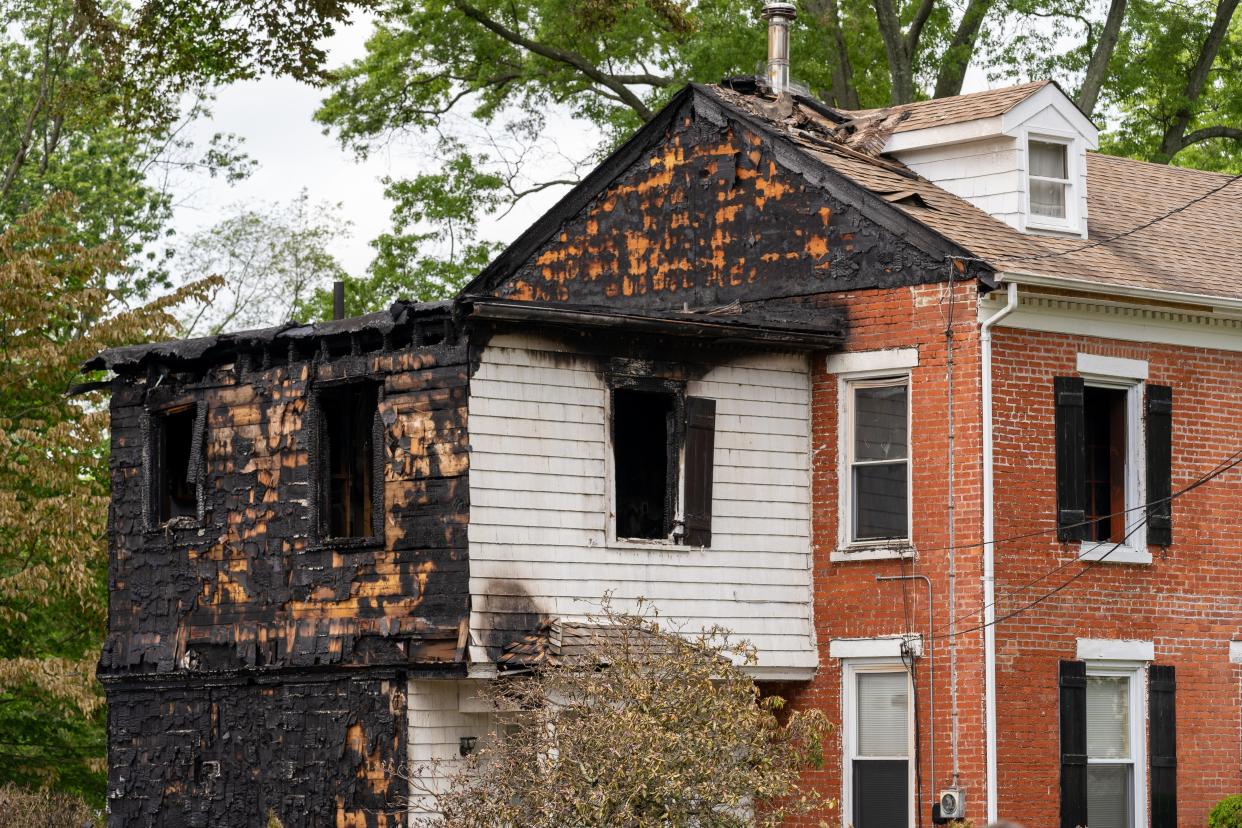 The three-alarm fire destroyed and damaged three Maple Avenue homes, leaving two families homeless.