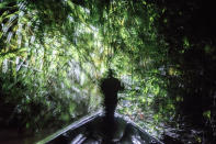 <p>Jose Miguel Santi leads a night hunting expedition on his cousin’s boat in the Ecuadorean Amazon. (© Misha Vallejo) </p>