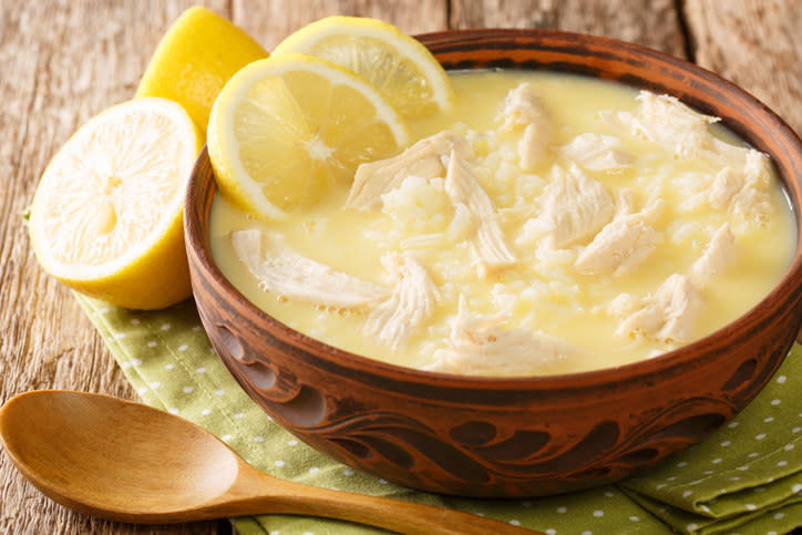 chicken soup with wedges of lemon