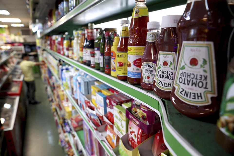 Heinz Ketchups are displayed in a grocery store in downtown Tehran, Iran, Wednesday, July 10, 2019. Whether at upscale restaurants or corner stores, American brands like Coca-Cola and Pepsi can be seen throughout Iran despite the heightened tensions between the two countries. U.S. sanctions have taken a heavy toll, but Western food, movies, music and clothing are still widely available. (AP Photo/Ebrahim Noroozi)