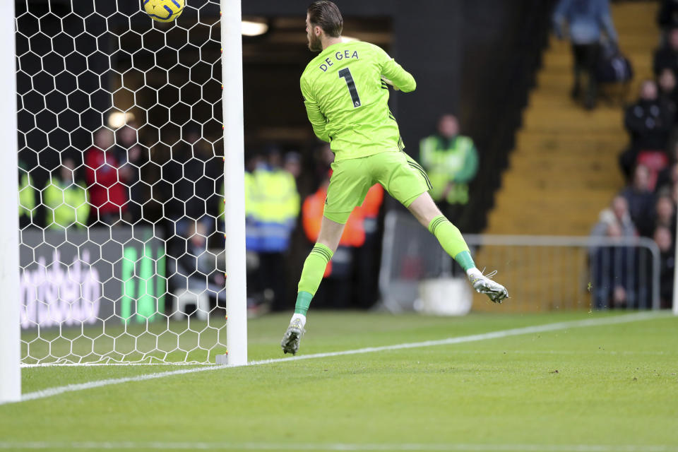 Manchester United's goalkeeper David de Gea fails to stop the ball as Watford's Ismaila Sarr scores his side's opening goal, during the English Premier League soccer match between Watford and Manchester United, at Vicarage Road Stadium, Watford, England, Sunday, Dec. 22, 2019. (AP Photo/Petros Karadjias)