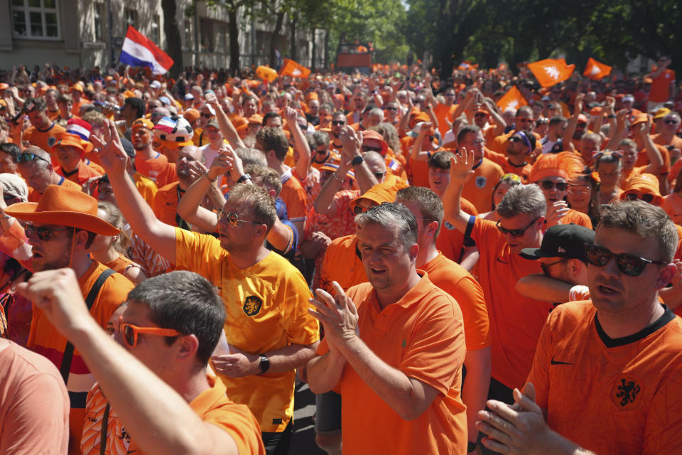 Dutch fans gather before a Group D match between the Netherlands and Austria at the Euro 2024 soccer tournament in Berlin, Germany, Tuesday, June 25, 2024. (AP Photo/Sunday Alamba)