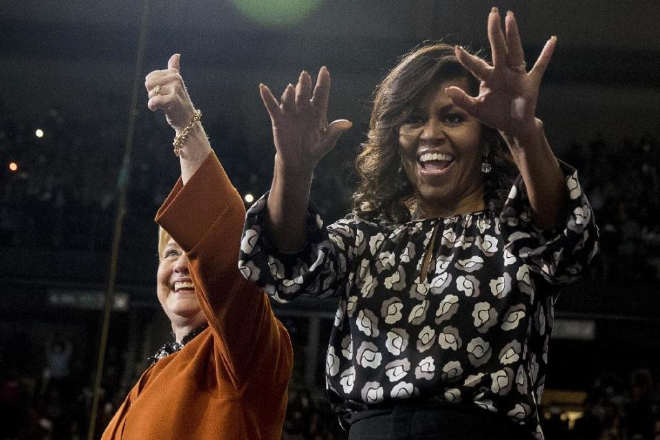 FILE - In this Oct. 27, 2016 file photo, first lady Michelle Obama takes the stage with then-Democratic presidential candidate Hillary Clinton, during a campaign rally at Wake Forest University in Winston-Salem, N.C. What does Michelle Obama do next? After eight years as a high-profile advocate against childhood obesity, a sought-after talk show guest, a Democratic power player and a style maven, the first lady will have her pick of options when she leaves the White House next month. (AP Photo/Andrew Harnik, File)