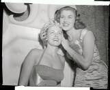 <p>American Miriam Stevenson, left, was the first to be crowned by the previous year's winner in 1954.</p>