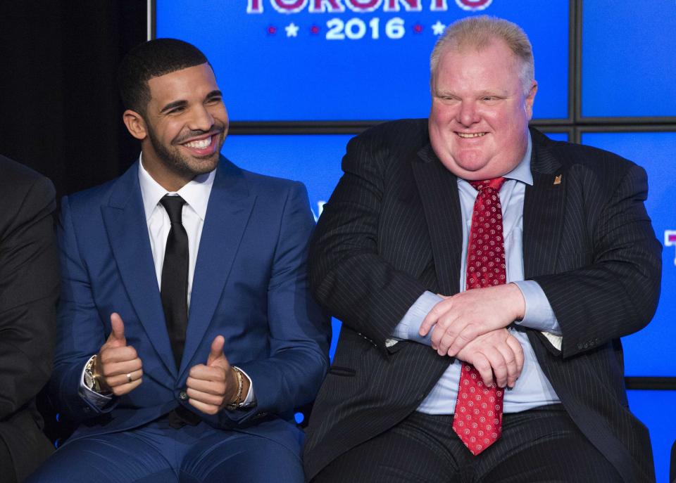 Rapper Drake sits with Toronto Mayor Rob Ford (R) during an announcement that the Toronto Raptors will host the 2016 NBA All-Star game in Toronto, September 30, 2013. Toronto was selected as the host of the National Basketball Association's (NBA) 2016 All-Star Game, marking the first time the showcase event will be held outside of the United States, the league said on Monday. REUTERS/Mark Blinch (CANADA - Tags: SPORT BASKETBALL ENTERTAINMENT)