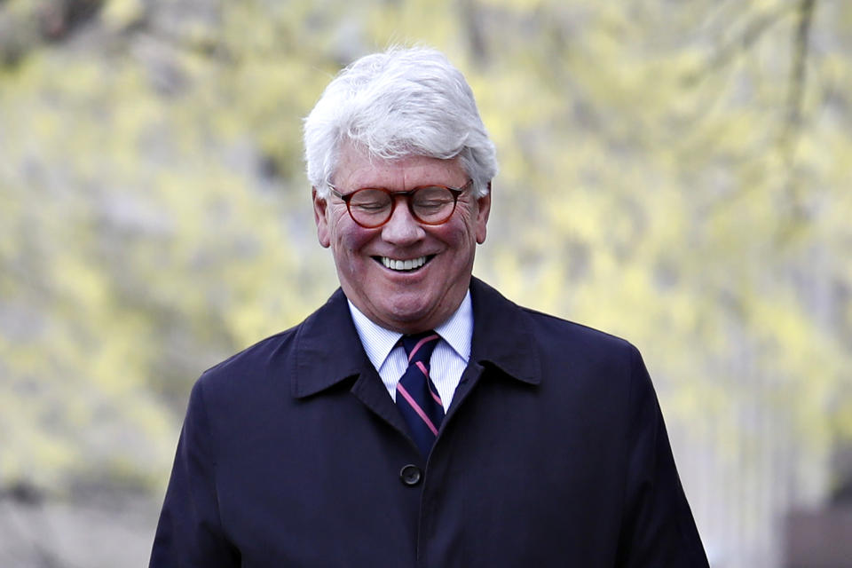 Greg Craig laughs as he arrives ahead of his arraignment at federal court in Washington on Friday April 12, 2019. (AP Photo/Jacquelyn Martin)