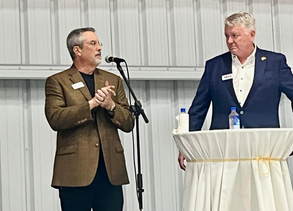 Candidate for Naples City Council Tony Perez-Benitoa (left) with mayoral candidate Gary Price (right) speaks to a group about the importance of the Naples Airport at a private event Feb. 28, 2024, hosted by Elite Jets in a hangar at the airport.