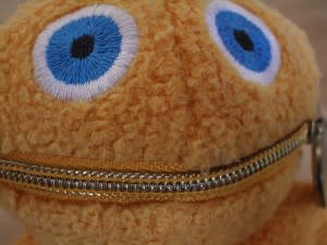 Soft toy with zipper mouth