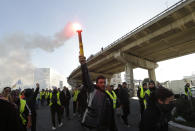 Yellow vest protesters march during a demonstration Saturday, Feb.16, 2019 in Marseille, southern France. Yellow vest protesters are holding scattered demonstrations around Paris and the rest of France amid waning support for their movement. (AP Photo/Claude Paris)