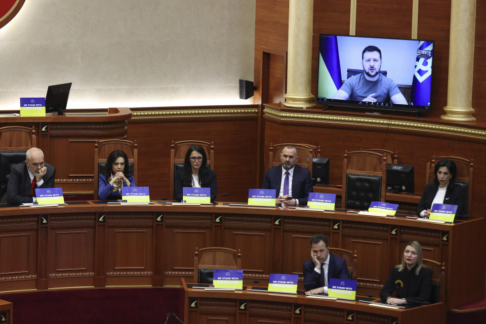 FILE - Albania's Prime Minister Edi Rama, left, and his cabinet listen the speech of Ukraine's President Volodymyr Zelenskyy via video conference in Tirana on May 3, 2022. Albania hosts on Thursday, Feb. 28, 2024 a summit of Southeastern European countries on peace, security and cooperation, focused on the war in Ukraine and Ukrainian President Volodymyr Zelenskyy will visit the country. (AP Photo/Franc Zhurda, File)