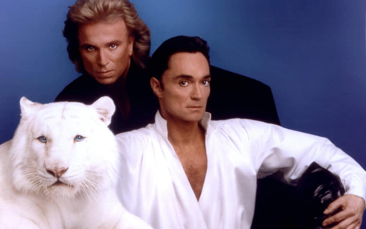 Roy Horn, right, with his partner Siegfried Fischbacher - Courtesy of Siegfried & Roy/The Mirage Resort via Getty Images