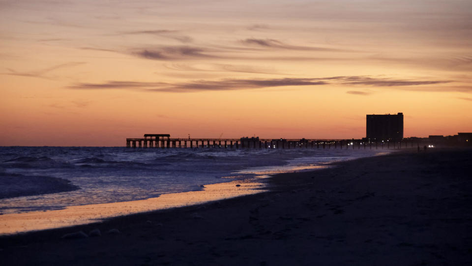 The sun sets Saturday, Feb. 4, 2023, in Myrtle Beach, S.C. Earlier in the day, a Chinese balloon was shot down in the area. (AP Photo/Chris Seward)